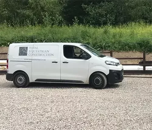 This image shows a Total Equestrian Construction van, representing our dedicated in-house team equipped with horse-friendly tools and machinery for every project.