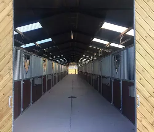 This image shows a modern stable block built with premium materials and waterproof construction, ensuring durability and protection for horses.